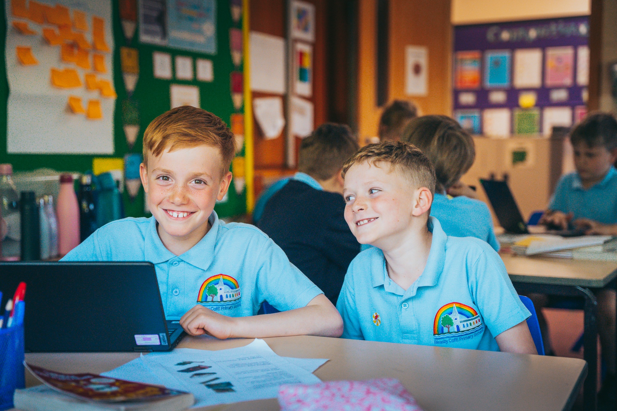 two students smiling in IT lesson