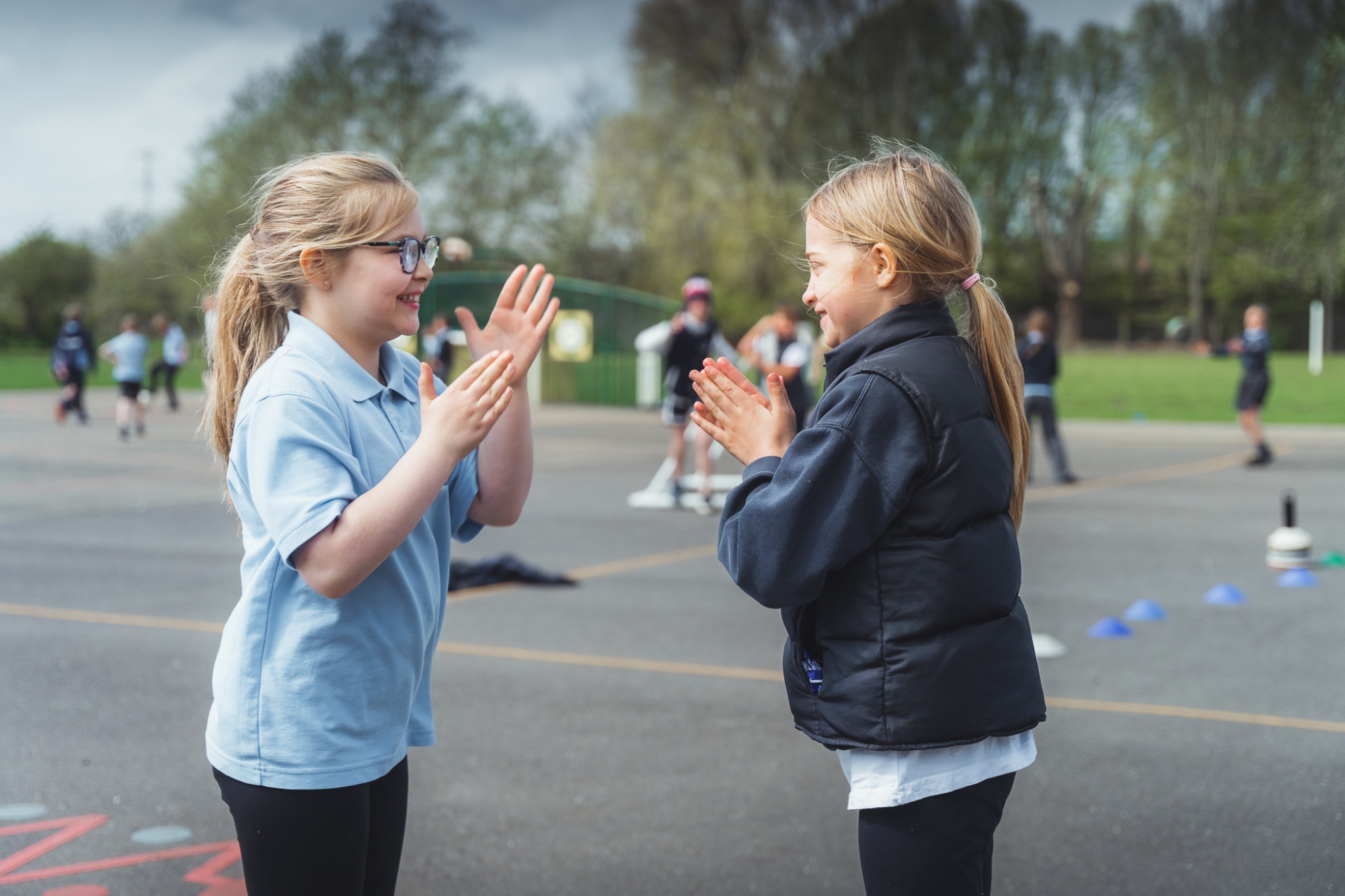 two students playing in the playground