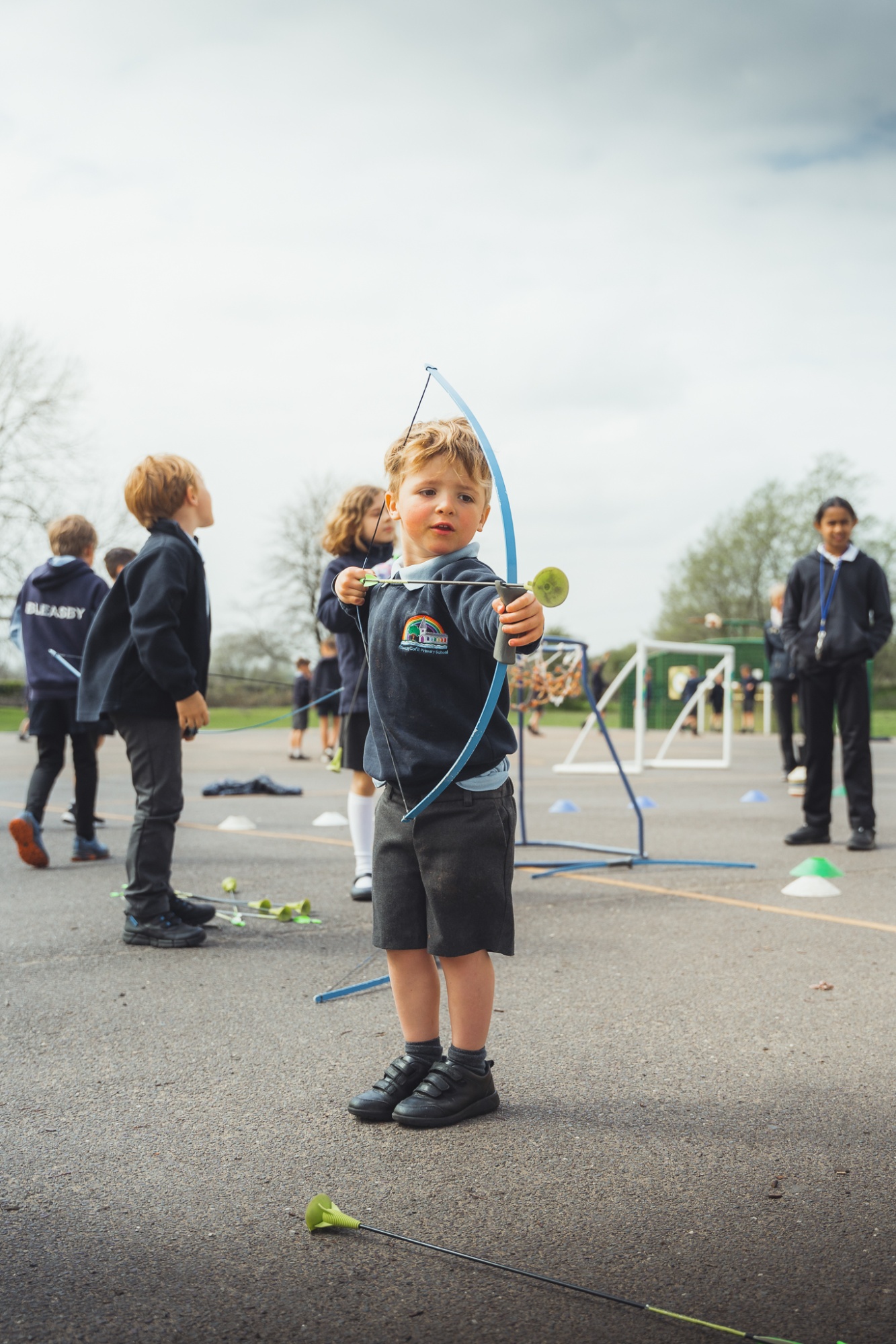 student doing archery at break time