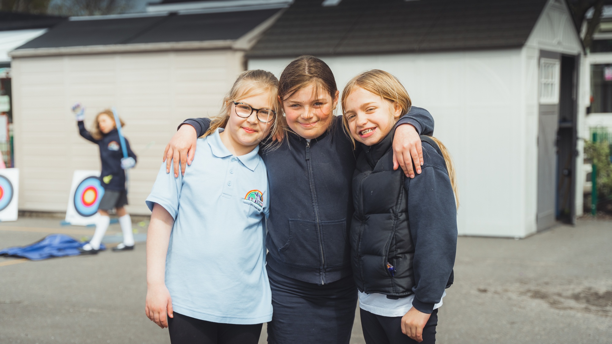 three students smiling